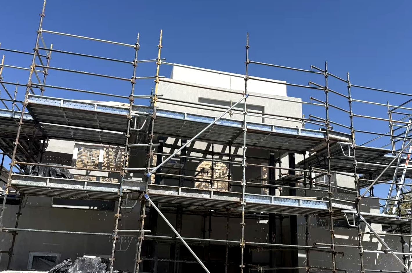 Construction — exterior cladding / scaffolding